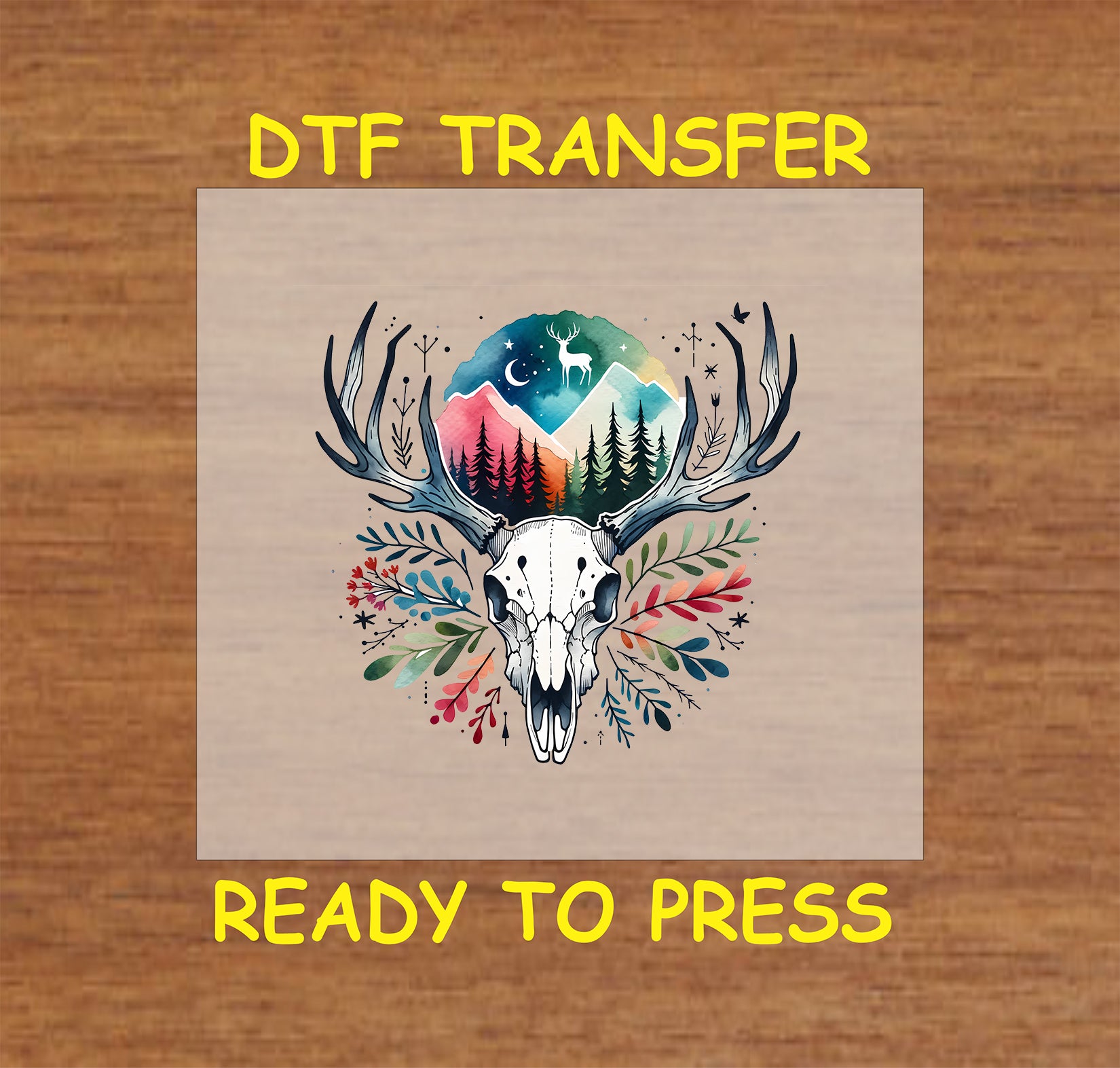 Deer skull DTF transfer with antlers, floral accents, mountain scene, trees, and stars.