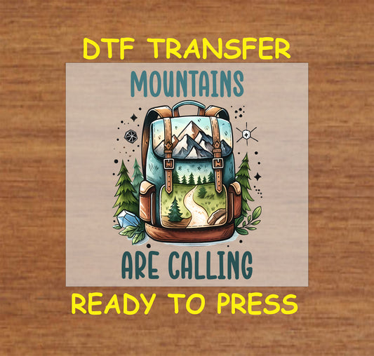 Mountains Are Calling DTF transfer with trail scene inside hiking backpack and pine trees.