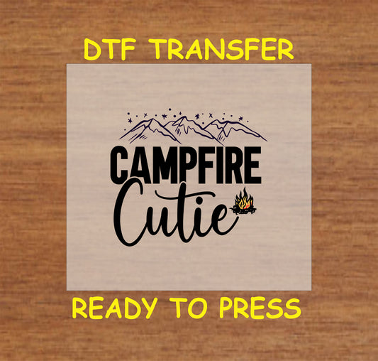 Campfire Cutie text with stars, mountains, and small campfire, ready-to-press DTF transfer.