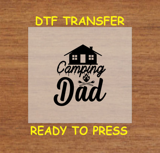 Camping Dad with cabin, crossed marshmallows, and small fire, ready-to-press DTF transfer.