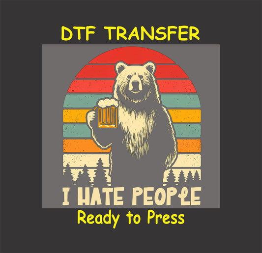 DTF transfer with retro bear holding beer and I Hate People quote in camping scene.