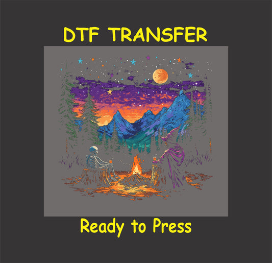 DTF transfer with witch and skeleton by campfire under stars, moon, and mountains.