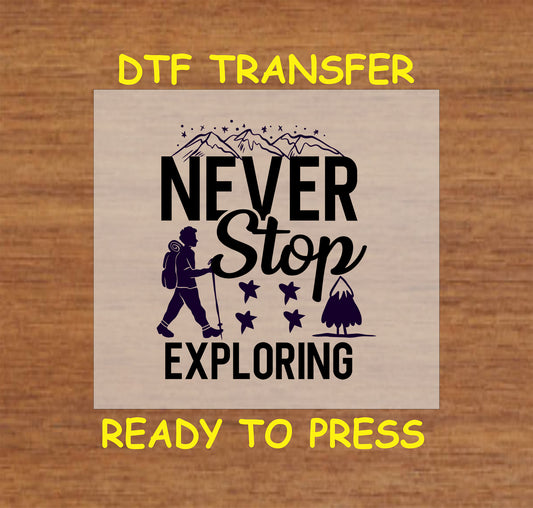DTF transfer with Never Stop Exploring quote, hiker silhouette, mountains, and stars.