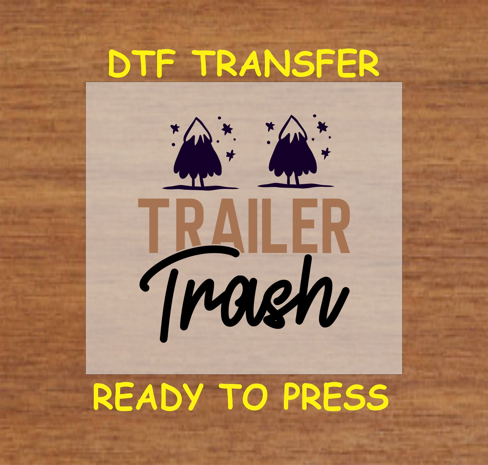 DTF transfer with Trailer Trash text and two trees with stars.