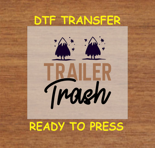 DTF transfer with Trailer Trash text and two trees with stars.