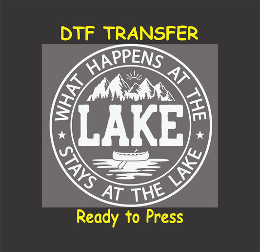 Black and white circular DTF transfer with mountains, canoe, and text What Happens at the Lake Stays at the Lake.