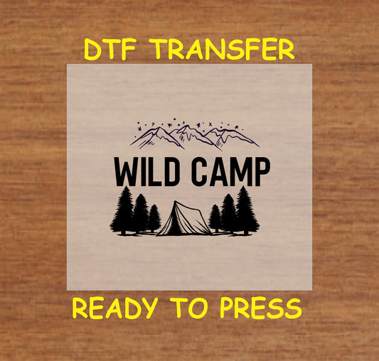 Black and white DTF transfer with tent, pine trees, mountain range, and the phrase Wild Camp.