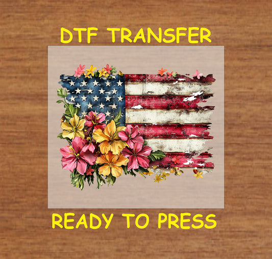 Rustic American flag with colorful hibiscus flowers in a DTF transfer.
