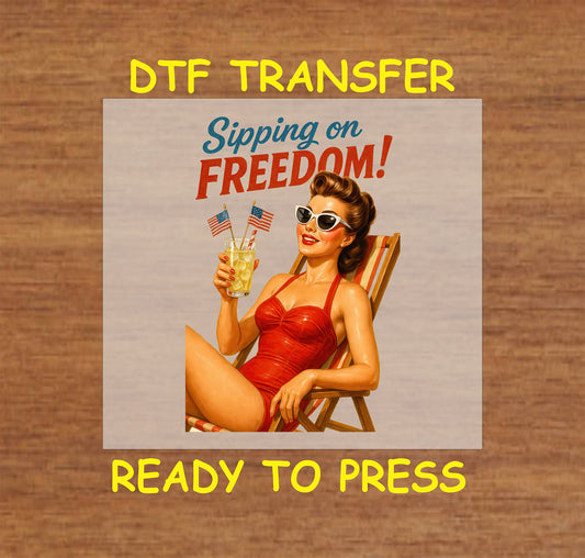 Retro pinup woman in red swimsuit holding lemonade with American flags and text Sipping on Freedom.
