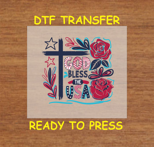 DTF transfer with cross, red roses, and God Bless the USA in patriotic colors.