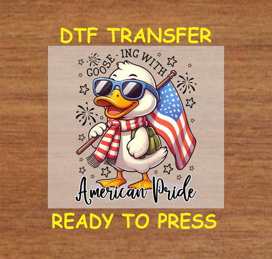 Cartoon goose holding flag wearing sunglasses with patriotic theme.