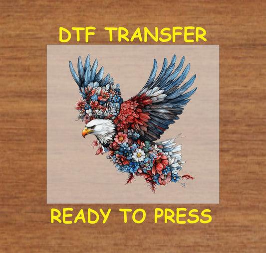 Eagle made of red, white, and blue flowers in flight.