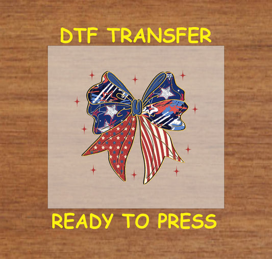 Distressed red, white, and blue bow with stars and stripes.