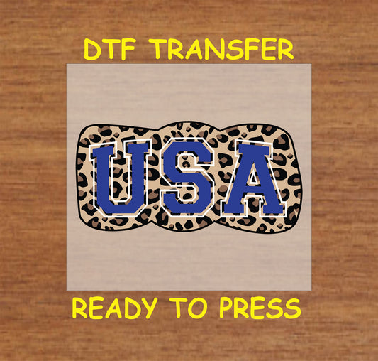 USA lettering on leopard print bow DTF transfer.