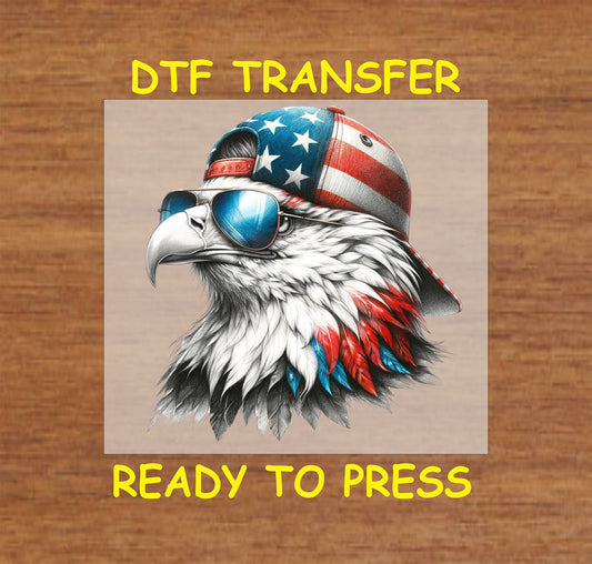 Eagle with American flag hat and blue sunglasses in red, white, and blue feathers on DTF transfer.