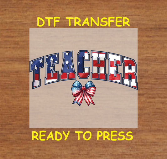 DTF transfer with patriotic stars and stripes "Teacher" text and red white blue bow.