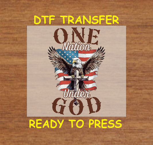 DTF transfer with bald eagle on cross, American flag background, and text One Nation Under God.