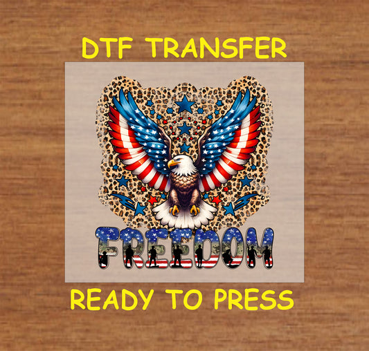 Freedom eagle DTF transfer with flag wings, leopard print background, and patriotic stars.
