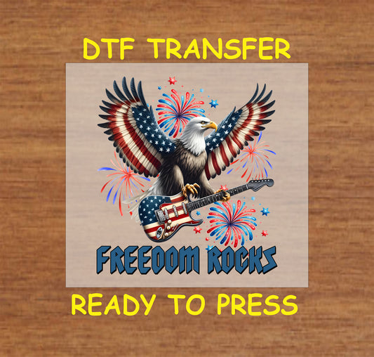 Eagle with American flag wings holding guitar and surrounded by fireworks with Freedom Rocks text.