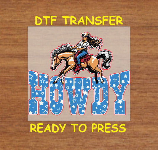 DTF transfer with cowgirl on horse above star-filled Howdy text in red, white, and blue.