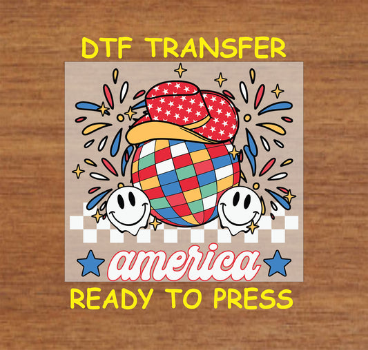 America DTF transfer with disco ball, smiley faces, fireworks, and cowboy hat.