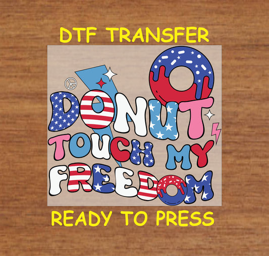 Donut Touch My Freedom text in patriotic colors with star-spangled donut illustrations for July 4th