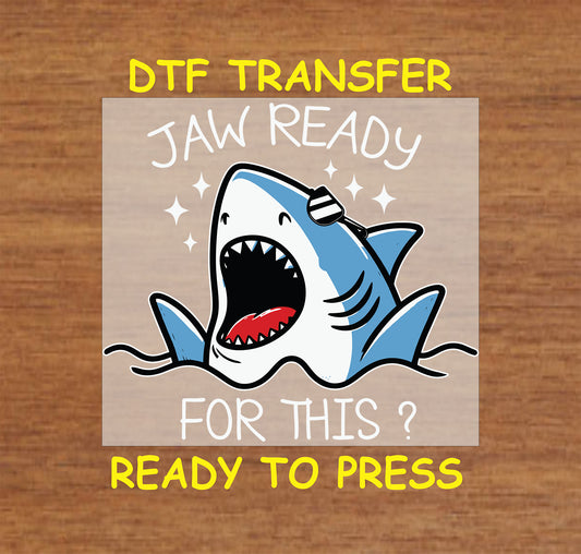 Cartoon shark with open mouth and text Jaw Ready For This in white above and below.