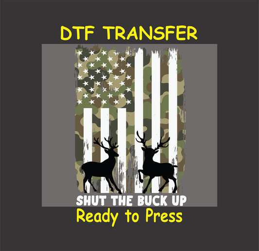 Camo American flag with two deer silhouettes and text Shut the Buck Up.