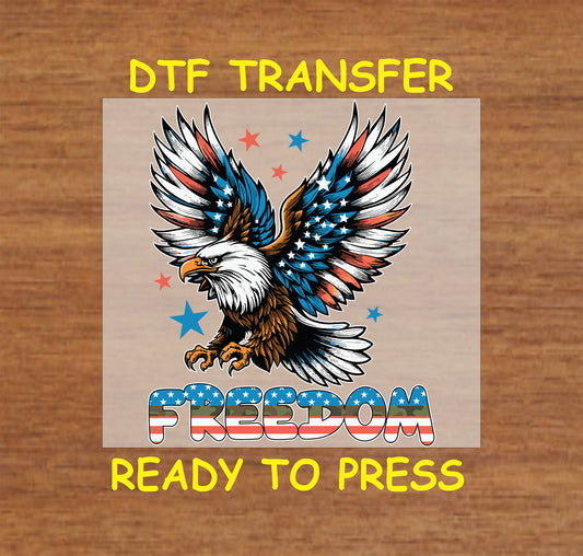 Flying bald eagle with patriotic wings and bold FREEDOM text in stars and stripes.