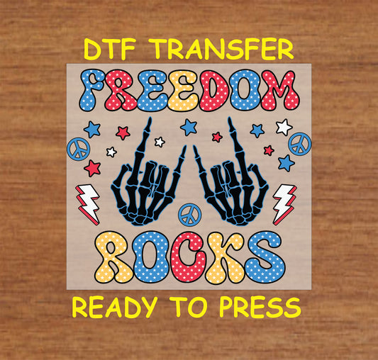 Freedom Rocks DTF transfer with skeleton hands and patriotic stars.