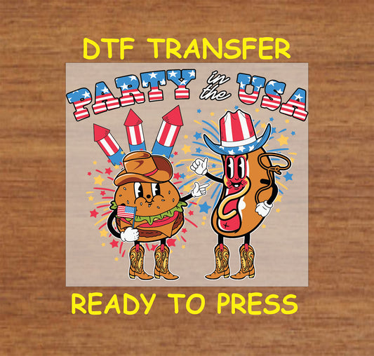DTF transfer showing cartoon burger and hot dog in cowboy boots with fireworks and text Party in the USA.