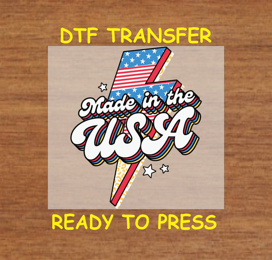 DTF transfer with Made in the USA text over red, white, and blue lightning bolt.