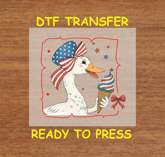 Duck with American flag bow holding red white and blue ice cream.