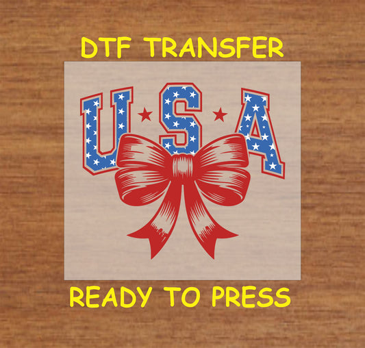 USA letters with stars and a red bow in the center.