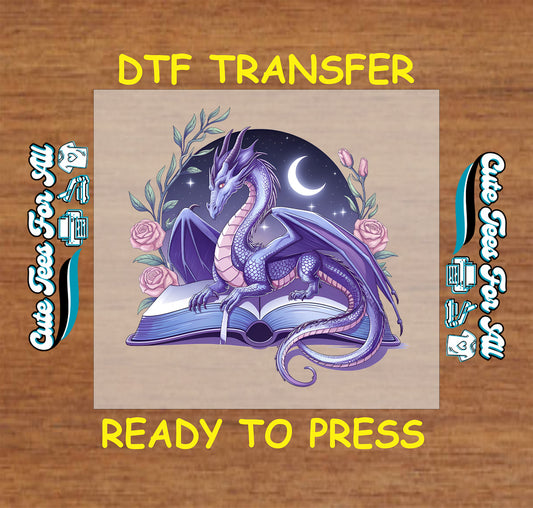 Purple dragon on open book DTF transfer with moon, stars, and pink roses.