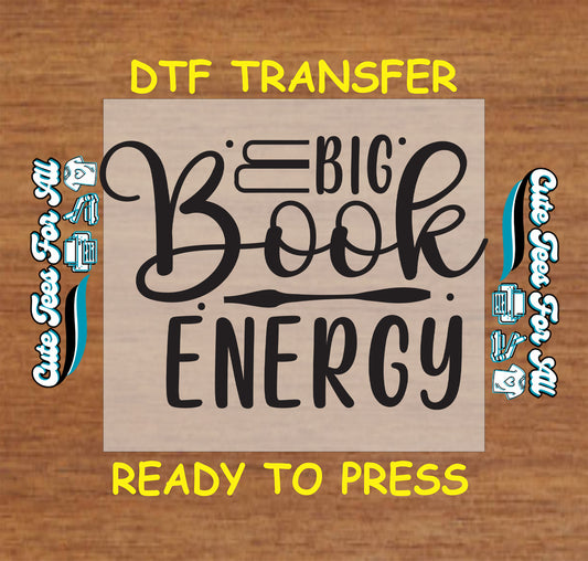 Big Book Energy DTF transfer with bold black lettering.