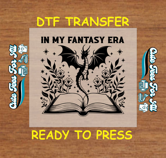 In My Fantasy Era DTF transfer with dragon, open book, flowers, and stars.