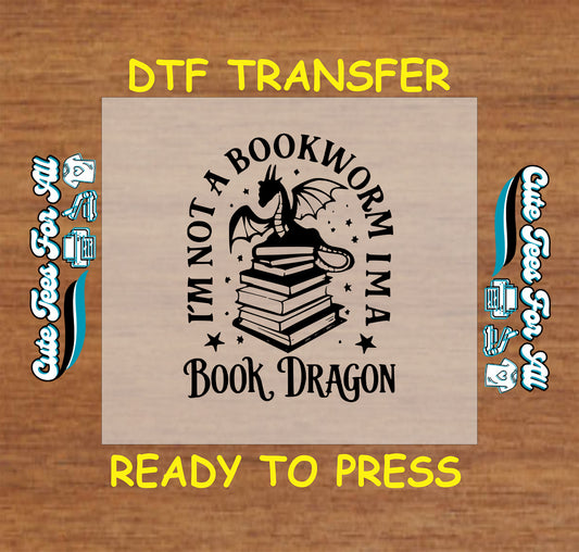 I'm Not a Bookworm I'm a Book Dragon DTF transfer with a dragon sitting on a stack of books.