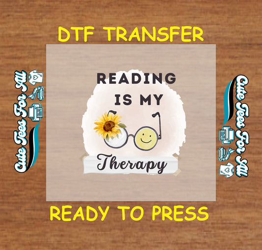 Smiley face glasses with sunflower and quote “Reading Is My Therapy” on watercolor background.