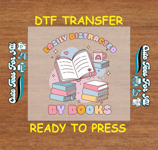 DTF transfer with pastel books, coffee mug, open book, and “Easily Distracted by Books” quote.