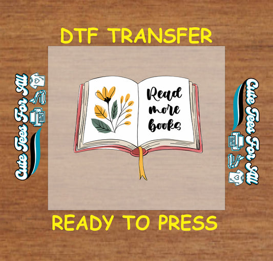 Open book with yellow florals and “Read More Books” text in script font.