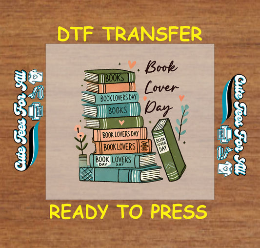 DTF transfer of stacked books with “Book Lover Day” text and heart accents.