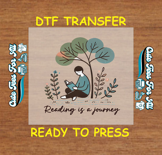 DTF transfer with person reading under a tree and quote “Reading is a journey”