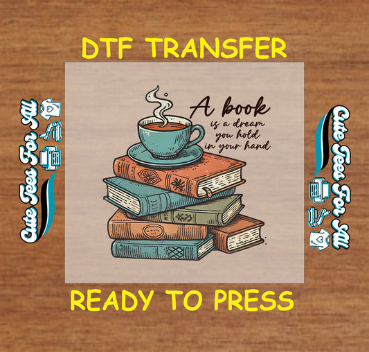 DTF transfer with vintage books, coffee cup, and quote “A book is a dream you hold in your hand”