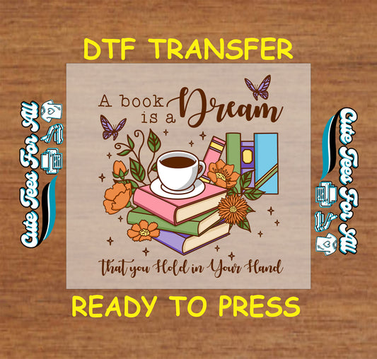 DTF transfer with books, coffee cup, butterflies, and the quote “A book is a dream that you hold in your hand”