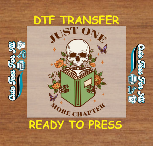 DTF transfer with skull reading a book, floral details, and “Just One More Chapter” text.