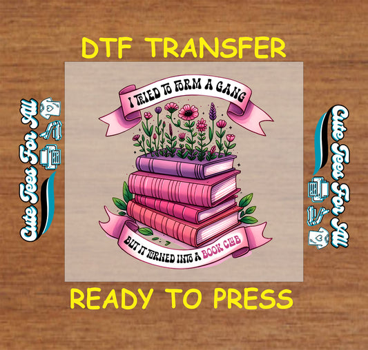 Stack of pink books with flowers and ribbon that says I tried to form a gang but it turned into a book club