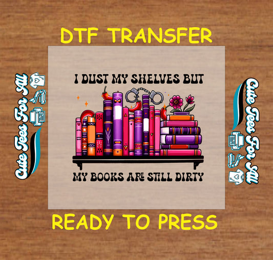 Shelf of colorful spicy books with flames, handcuffs, and flowers and the phrase I dust my shelves but my books are still dirty.