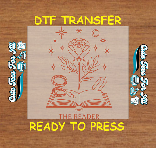 Mystical DTF with rose, snake, and moon emerging from an open book.