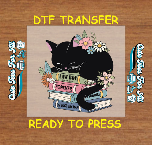 Black cat sleeping on stacked books with pastel flowers, DTF transfer for book lovers.